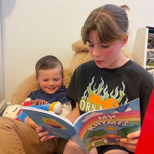 two children reading My Rhymes