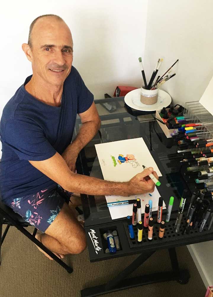 Illustrator Peter Townsend drawing Danny sitting at his desk